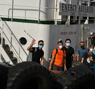 Seafarers disembark Odfjell's chemical tanker Bow Sun after the ship was rerouted to Manila for the sole purpose of facilitating crew changes during the Covid-19 pandemic. 
